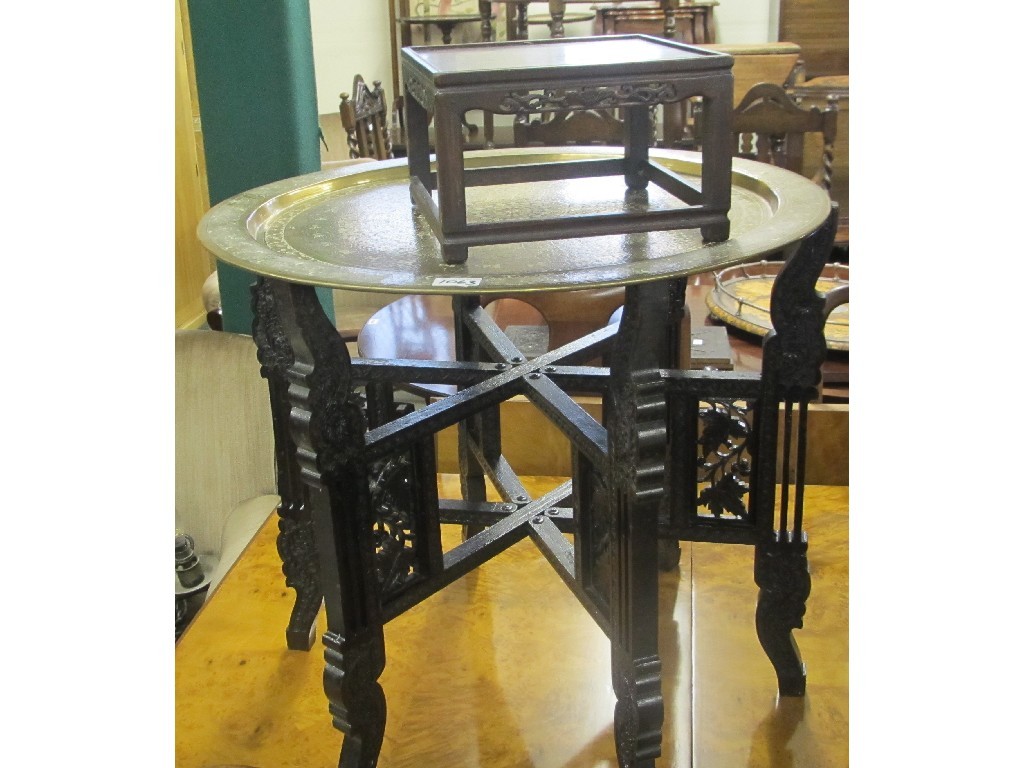 Appraisal: Eastern brass top table and a Chinese hardwood stand