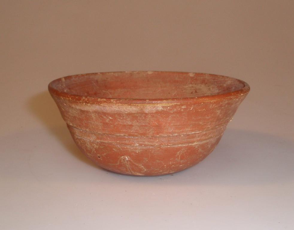 Appraisal: A Roman African Red Slip hemispherical bowl with flaring lip