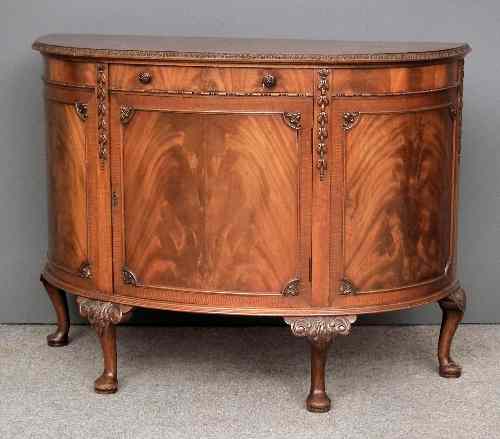 Appraisal: A s figured mahogany bow-front commode of th Century design