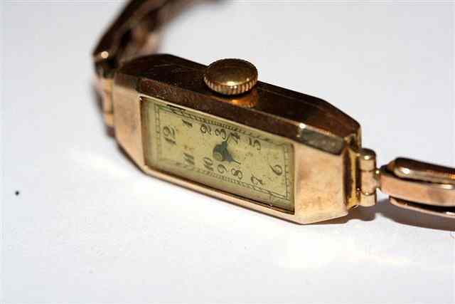 Appraisal: A LADY'S CT GOLD WRIST WATCH with rectangular dial and