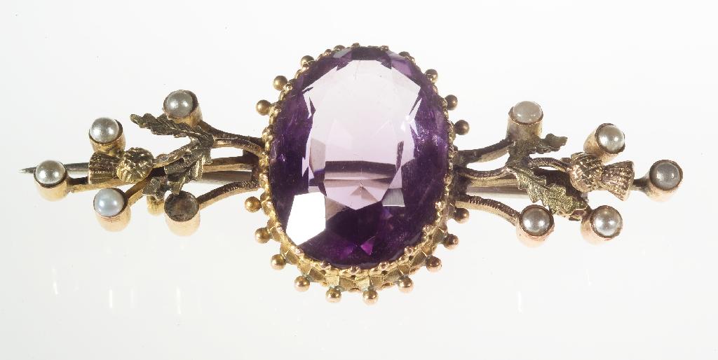 Appraisal: AMETHYST AND HALF PEARL BROOCH c the oval mixed-cut amethyst