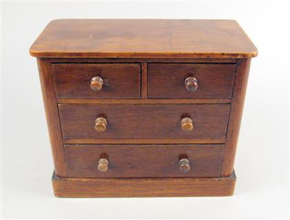 Appraisal: Miniature English mahogany chest of drawers The rectangular top with