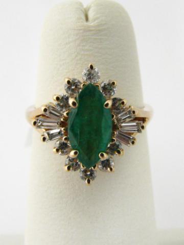 Appraisal: k yellow gold ring with marquise emerald approx ct surrounded