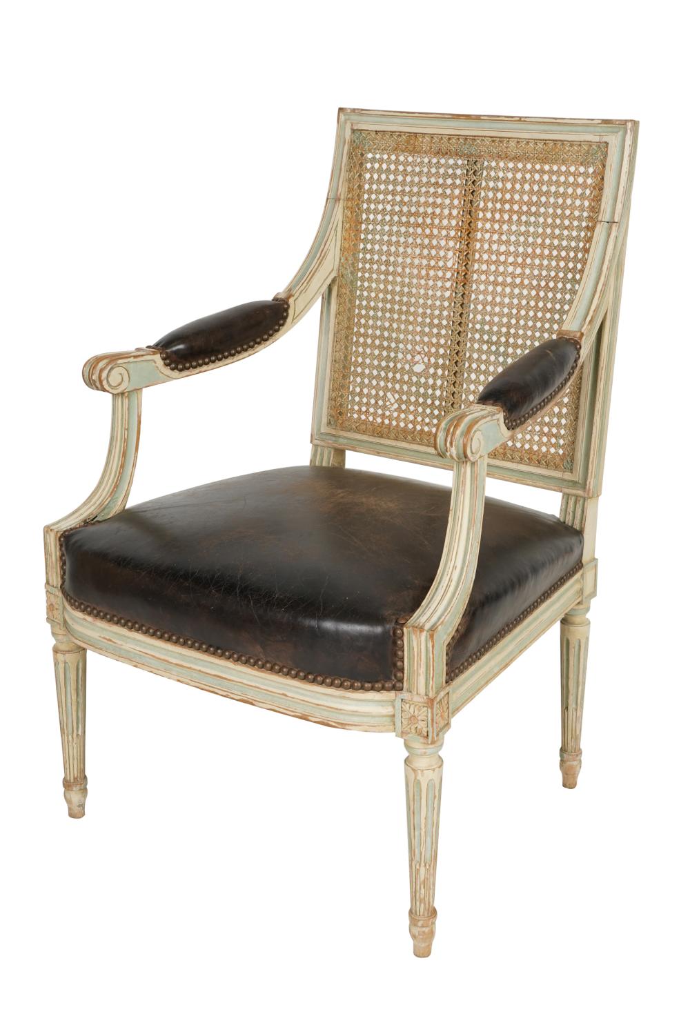 Appraisal: LOUIS XVI STYLE PAINTED FAUTEUILwith caned back and brown leather-covered