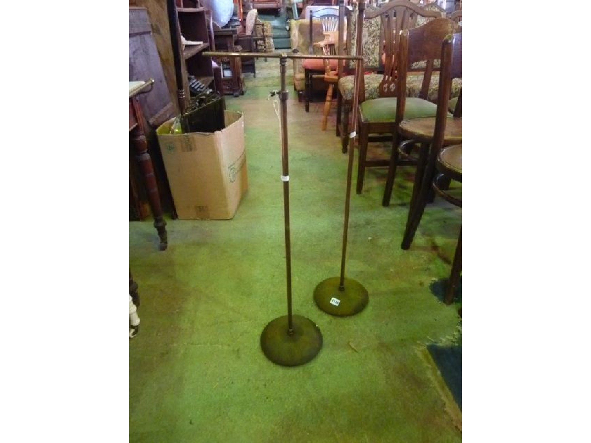 Appraisal: A pair of small vintage anodised floorstanding shop display stands