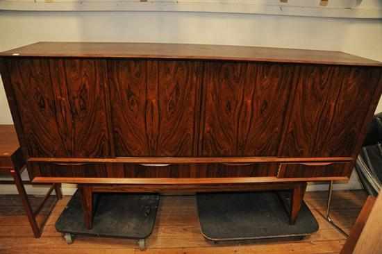 Appraisal: A DANISH ROSEWOOD SIDEBOARD with four sliding doors above four