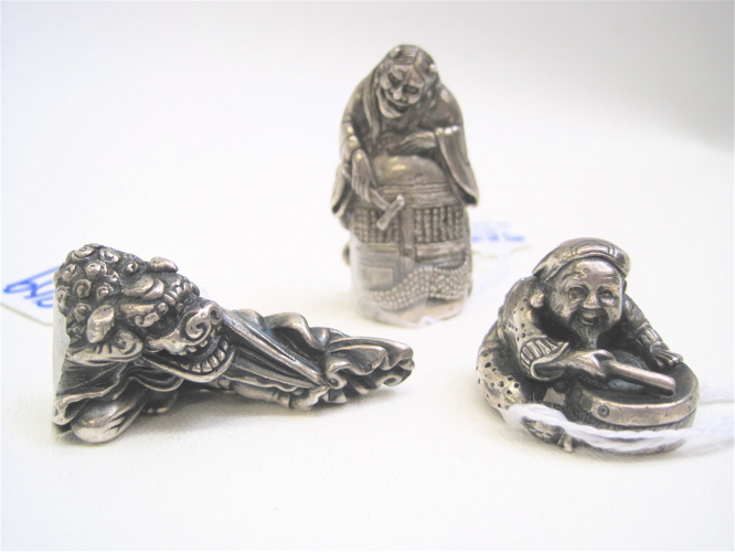 Appraisal: THREE JAPANESE SOLID SILVER NETSUKE dragon head L devil H