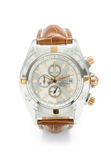 Appraisal: A BREITLING STAINLESS STEEL WATCH WITH GOLD ACCENTS A BREITLING