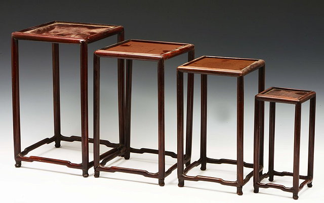 Appraisal: FOUR CHINESE HARDWOOD GRADUATED URN STANDS each with a square