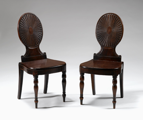 Appraisal: Pair of mahogany hall chairs mid th century In the