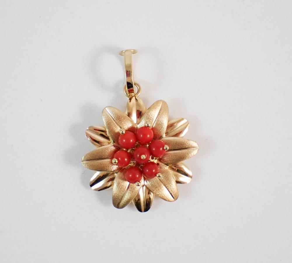 Appraisal: ITALIAN MADE CORAL AND FOURTEEN KARAT GOLD PENDANT The k