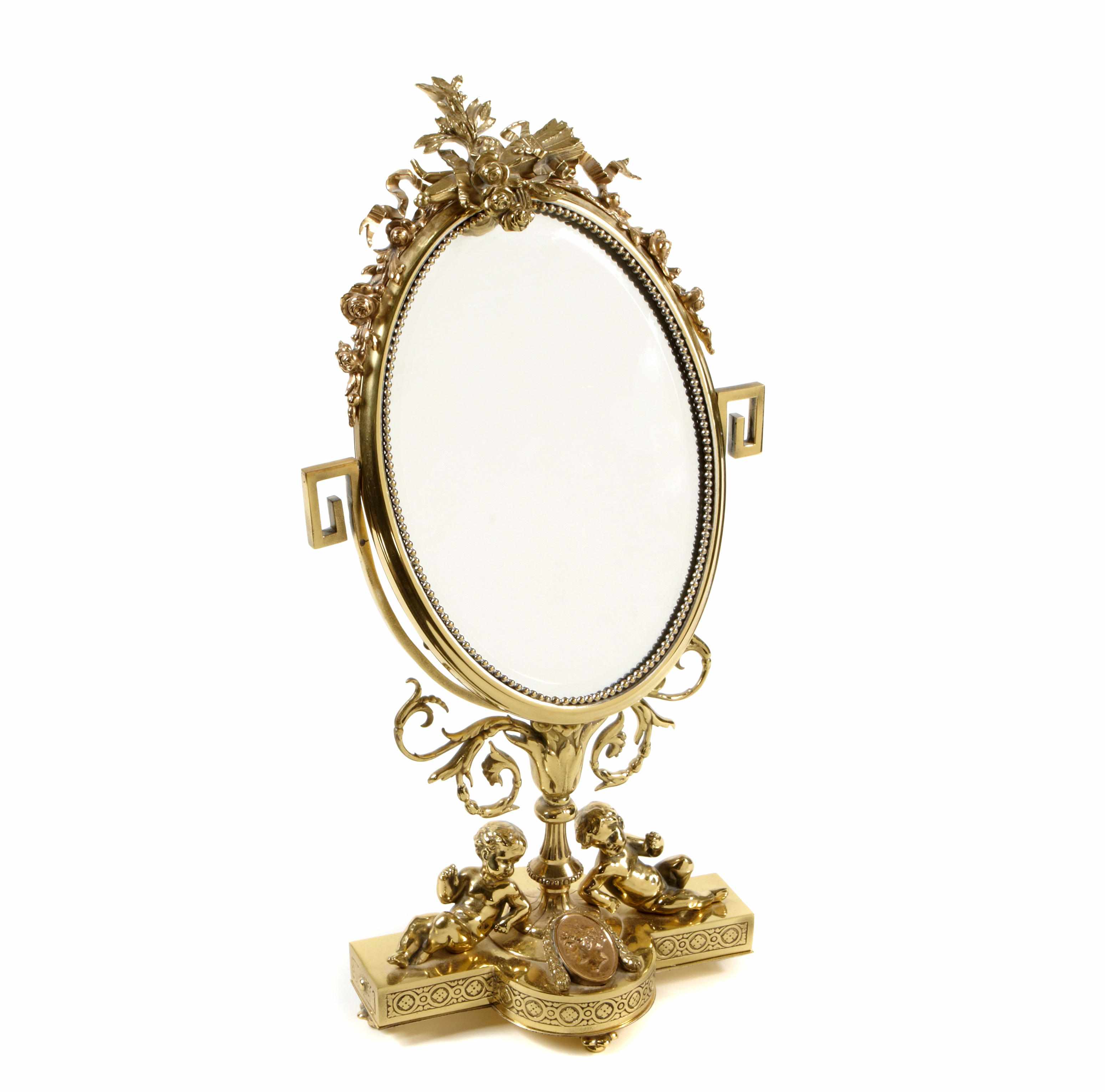 Appraisal: A Louis XVI style gilt bronze table mirror height in