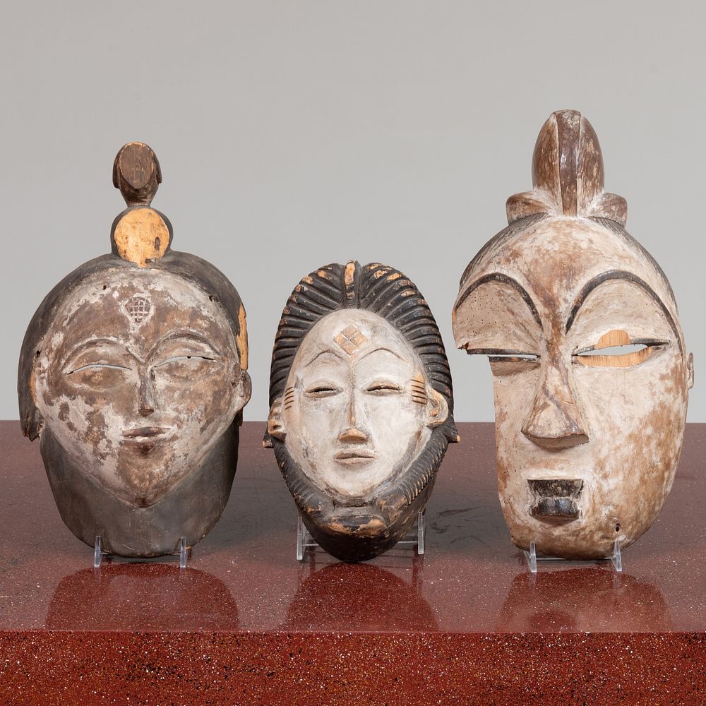 Appraisal: Two Mitsogo Painted Wood Masks Gabon Together with a smaller