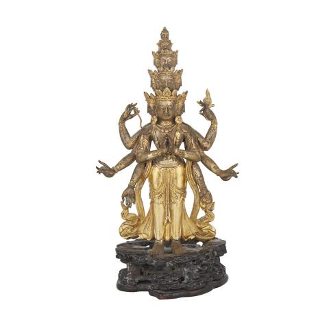 Appraisal: A GILT BRONZE FIGURE OF AN ELEVEN-HEADED AVALOKITESVARA Sino-Tibet TH