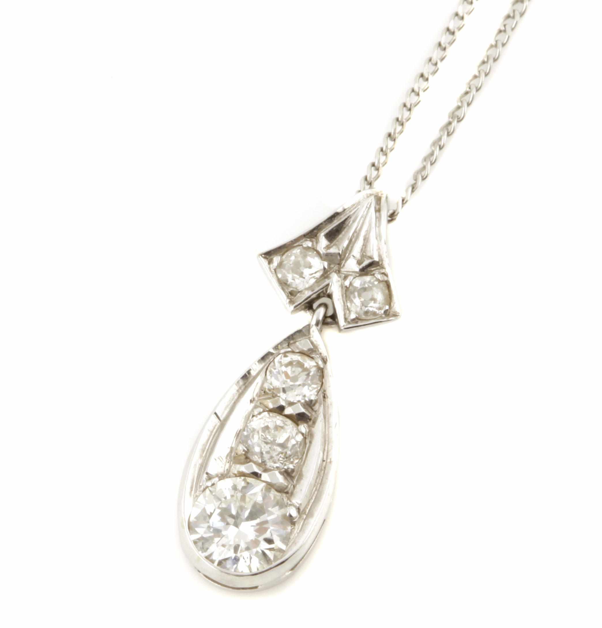 Appraisal: A diamond and white gold pendant with chain featuring two