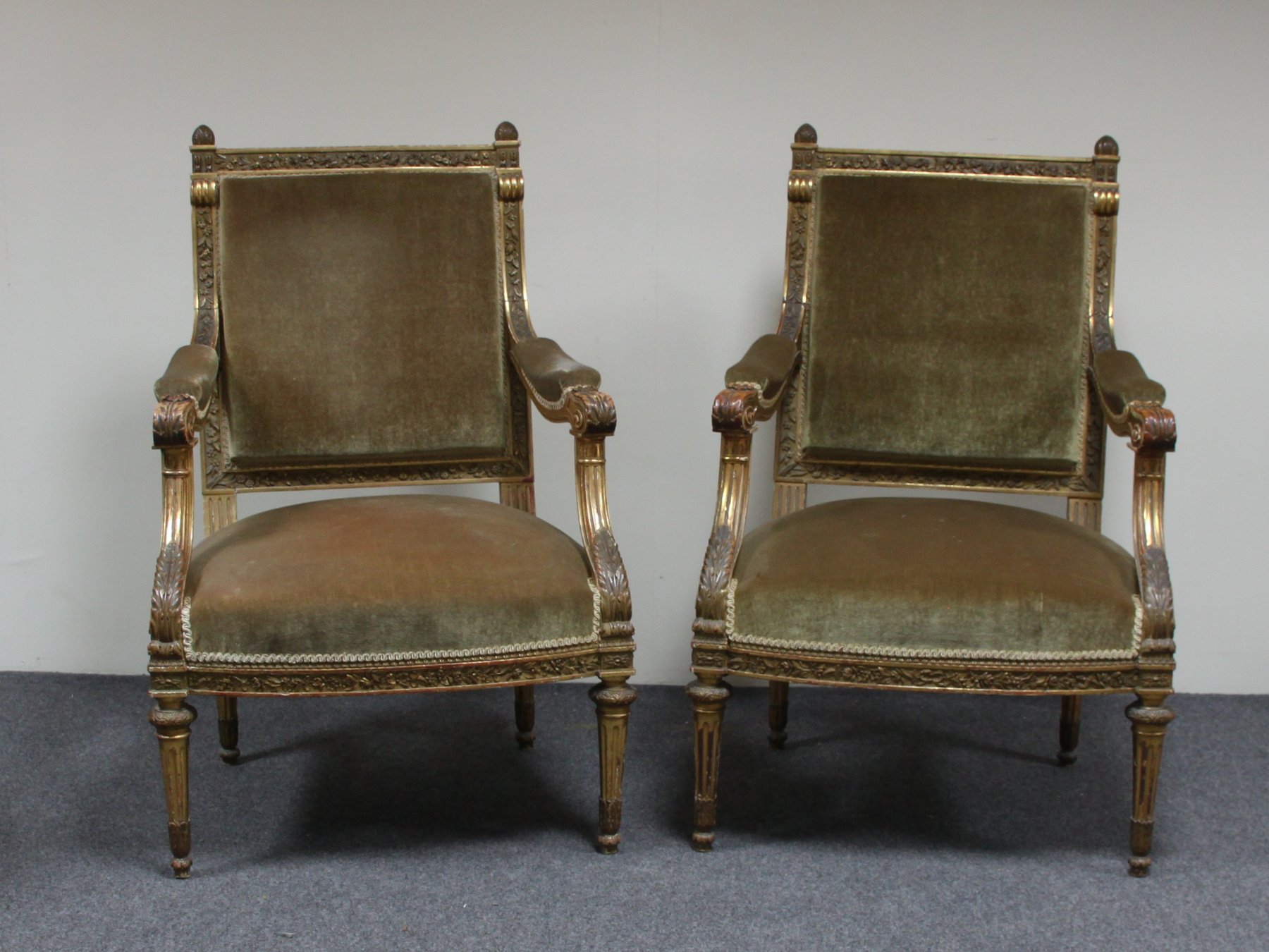 Appraisal: A pair of Victorian carved and gilded open armchairs each