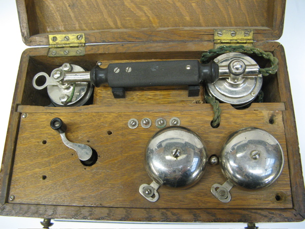 Appraisal: AN AMERICAN TH CENTURY OAK CASED TELEPHONE with crank operator