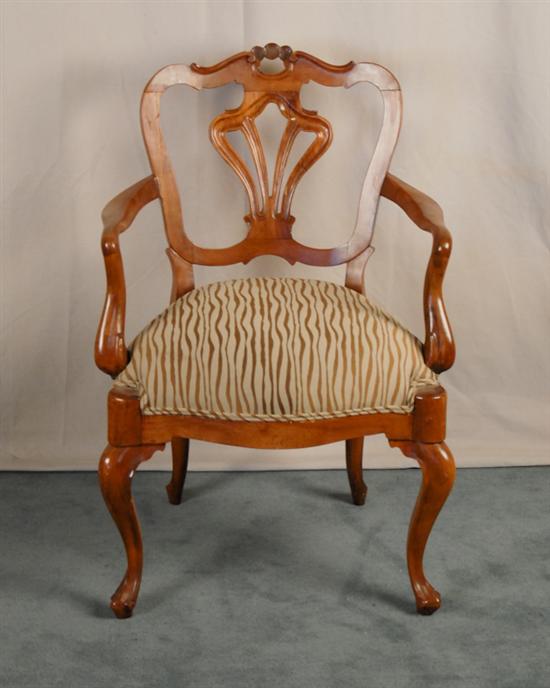 Appraisal: An Italian Fruitwood Armchair having a shaped crest with scallop