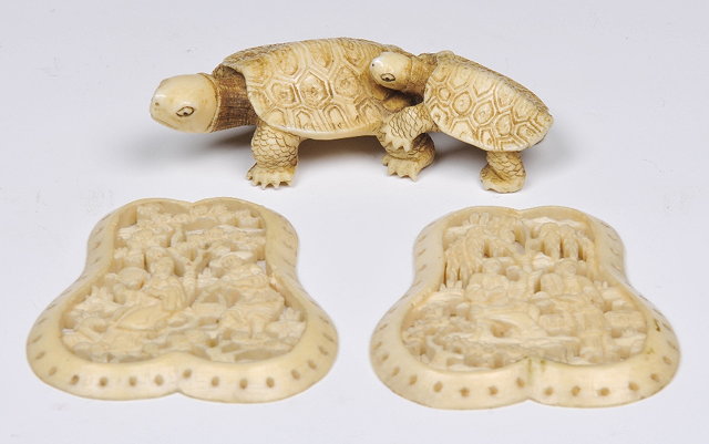 Appraisal: AN IVORY OKIMONO of two tortoises and two Chinese carved