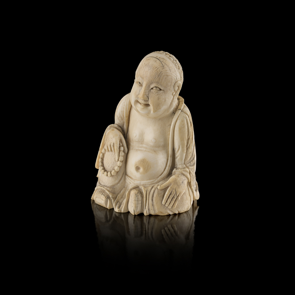 Appraisal: YCARVED IVORY FIGURE OF HOTEI MEIJI PERIOD seated with the