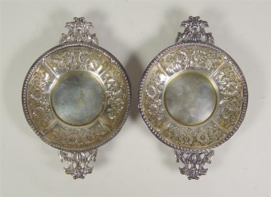 Appraisal: Pair of English Sterling Porringers Repousse flowers and cast handles