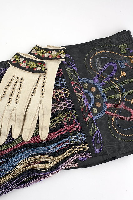 Appraisal: A Victorian black embroidered shawl with coloured fringe and a