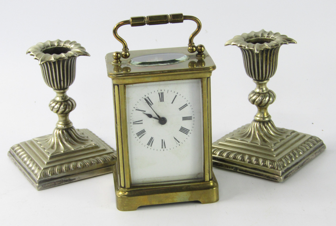 Appraisal: A brass carriage clock white enamel dial bearing Roman numerals