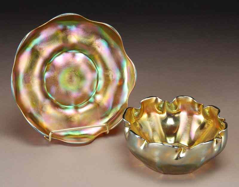 Appraisal: Tiffany gold Favrile finger bowl and underplate undulating rimmed bowl