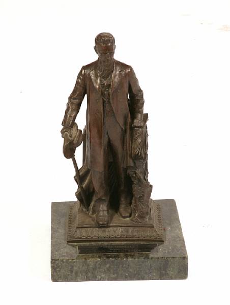 Appraisal: A bronze figure of Ezra Cornell on a marble plinth