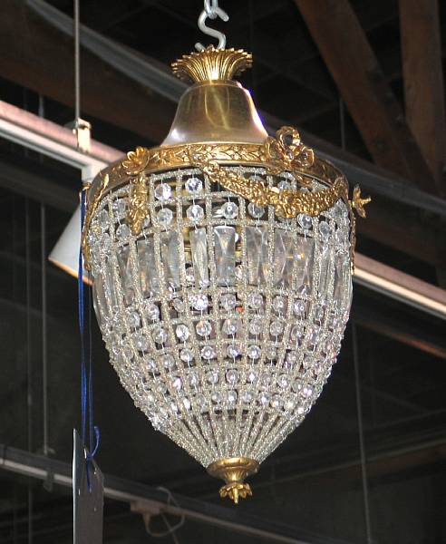 Appraisal: A pair of Neoclassical gilt metal and glass hall lanterns