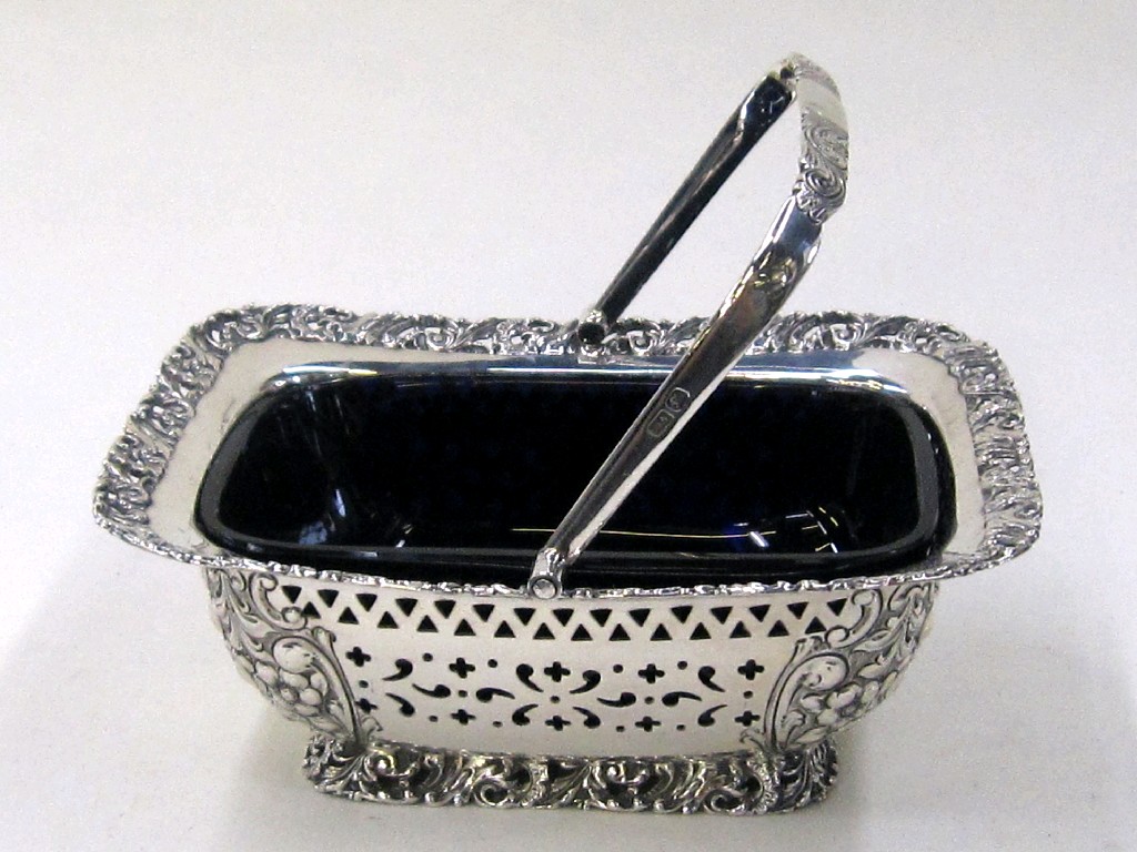 Appraisal: Late Victorian silver sugar basket with blue glass liner Sheffield