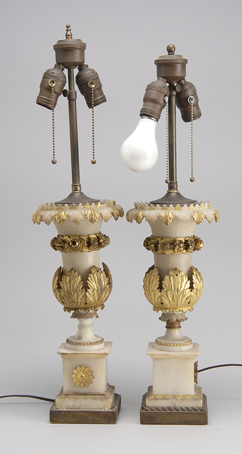 Appraisal: PAIR OF ELABORATELY CARVED ALABASTER VASES mounted as table lamps