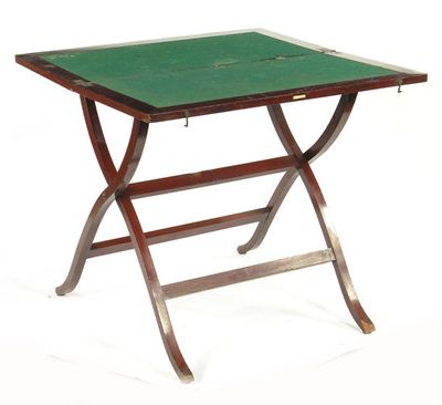 Appraisal: A mahogany coaching card table with baize lined interior and