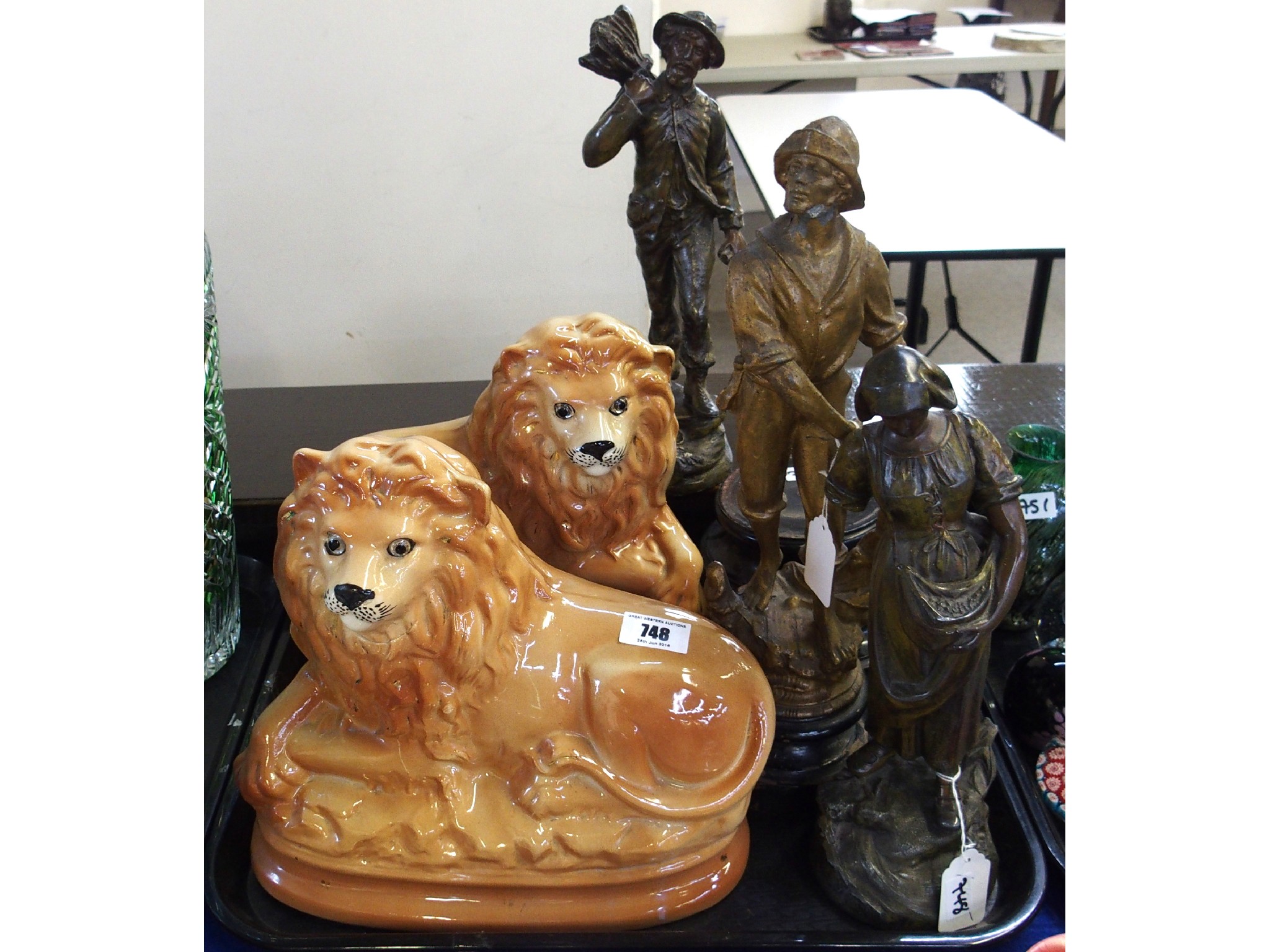 Appraisal: Pair of pottery lions and assorted spelter figures