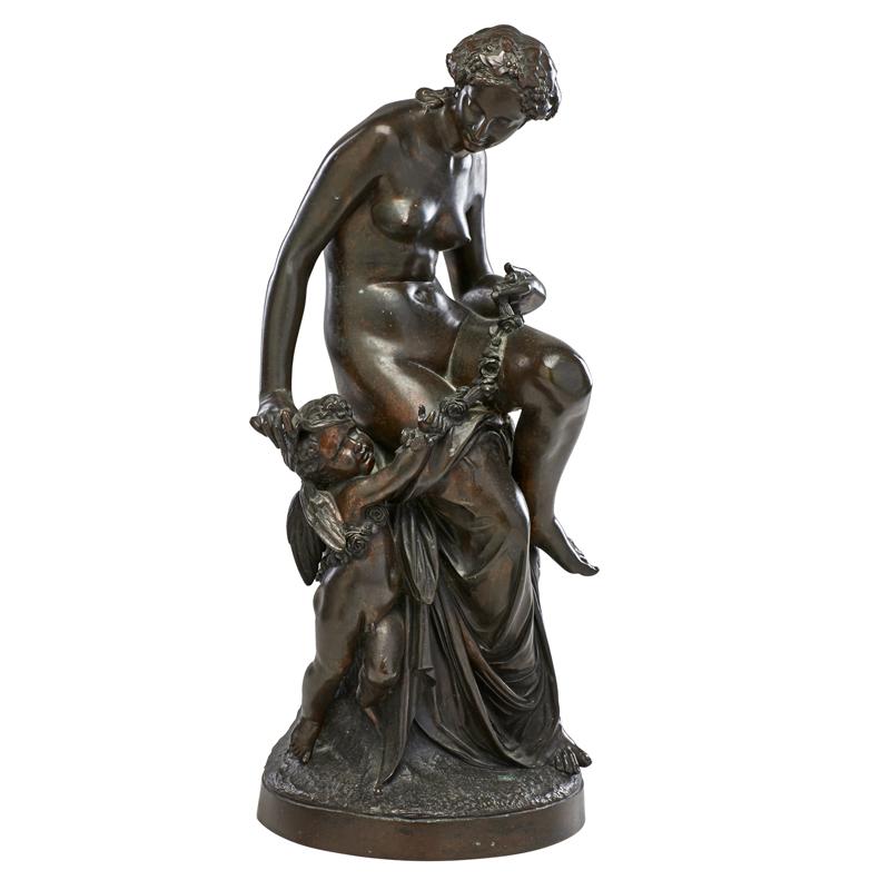 Appraisal: CLASSICAL BRONZE STATUE Figure of nude woman and a cherub