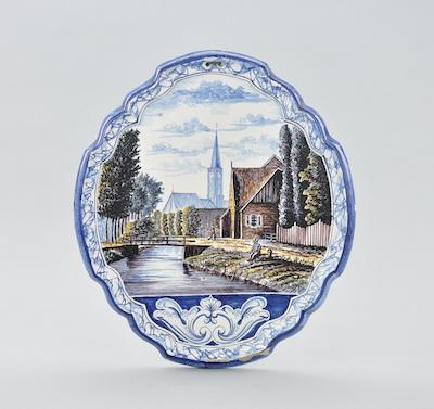 Appraisal: A Continental Faience Plaque Cartouche form landscape depicting figure boating