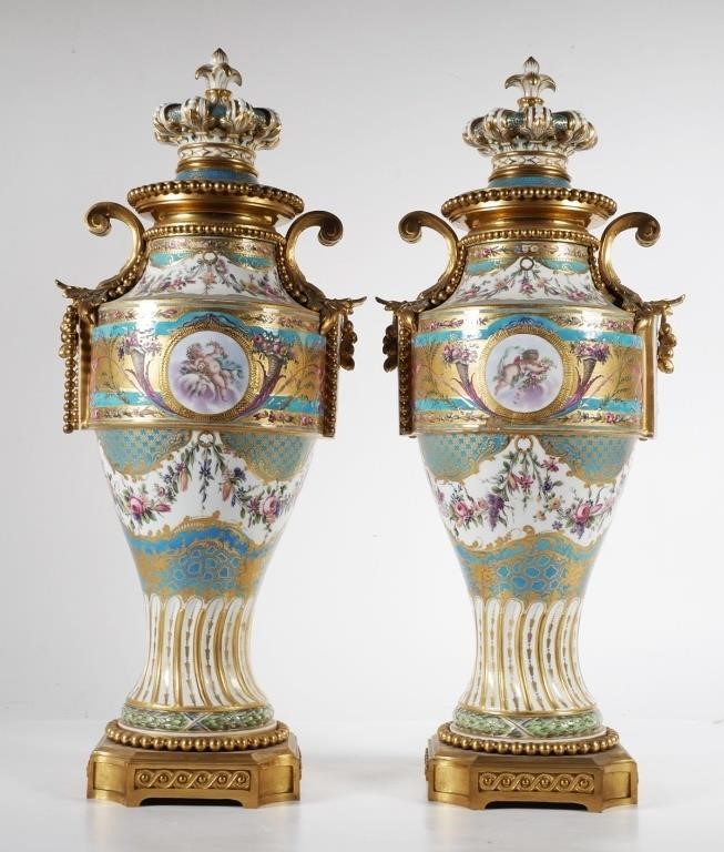 Appraisal: Antique pair of Sevres style porcelain urns measuring about -