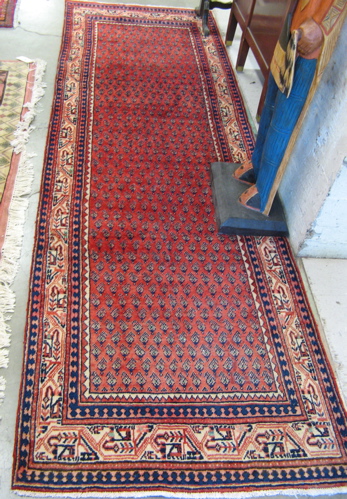 Appraisal: PERSIAN SERABAND HALL RUG overall boteh motif on red ground