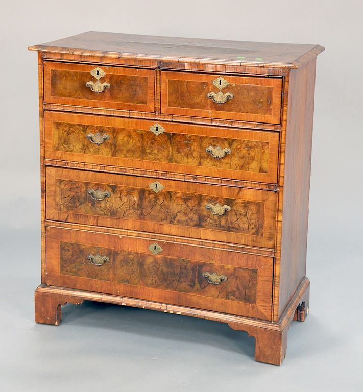 Appraisal: George II style walnut oyster veneered two over three drawer