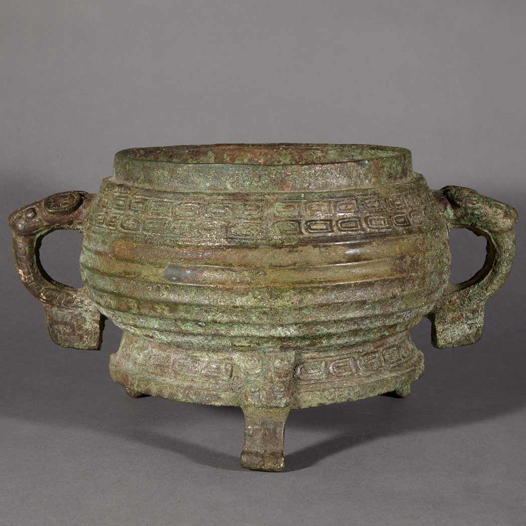 Appraisal: Chinese Bronze Censer Han Dynasty The compressed globular body worked