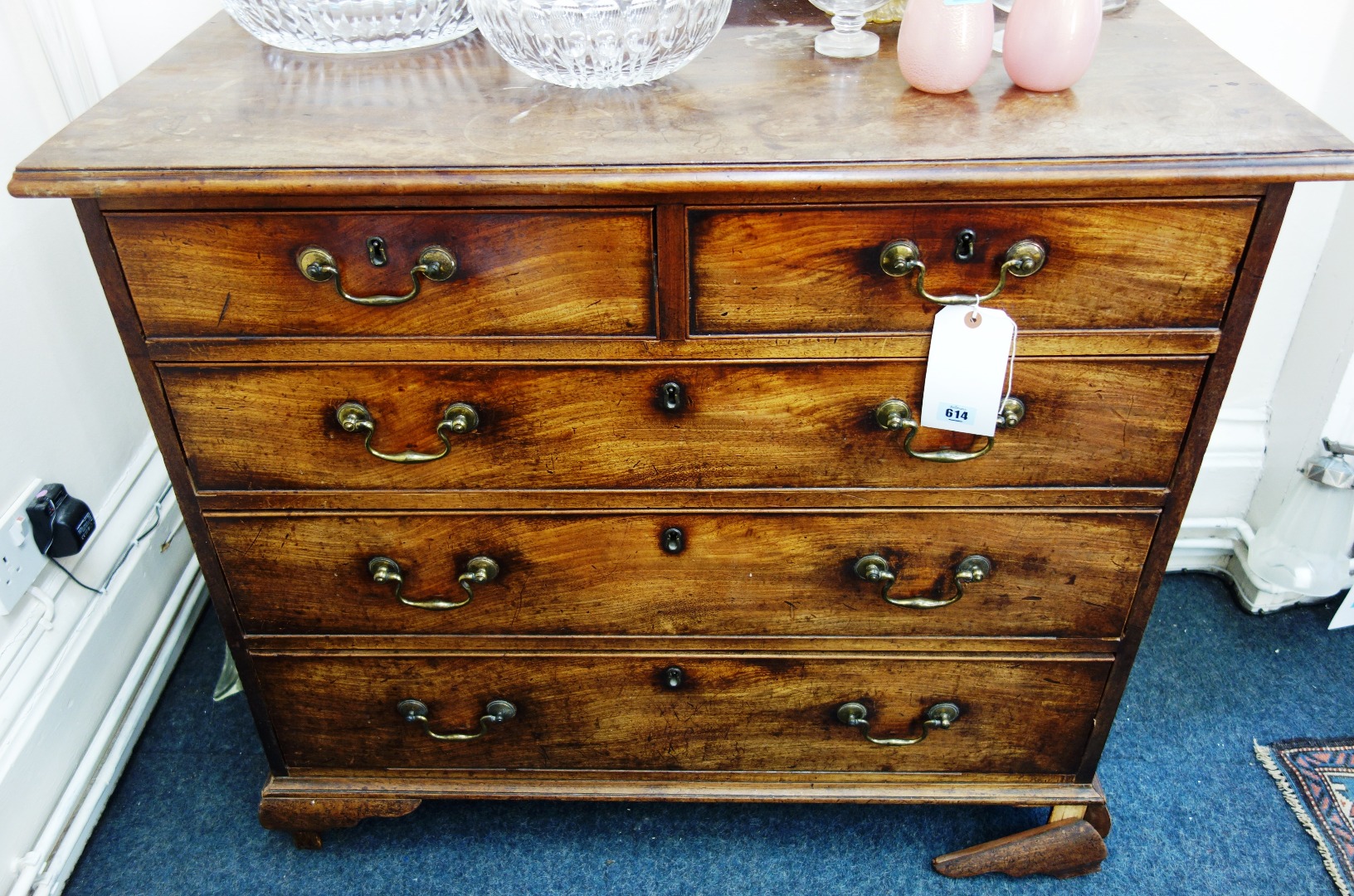 Appraisal: A George III mahogany chest fitted with two short and