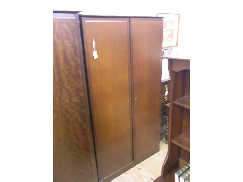 Appraisal: A Stag Minstrel mahogany wardrobe enclosed by a pair of