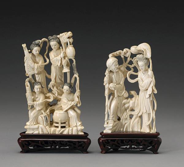 Appraisal: Two carved and tinted ivory figural groups th Century The