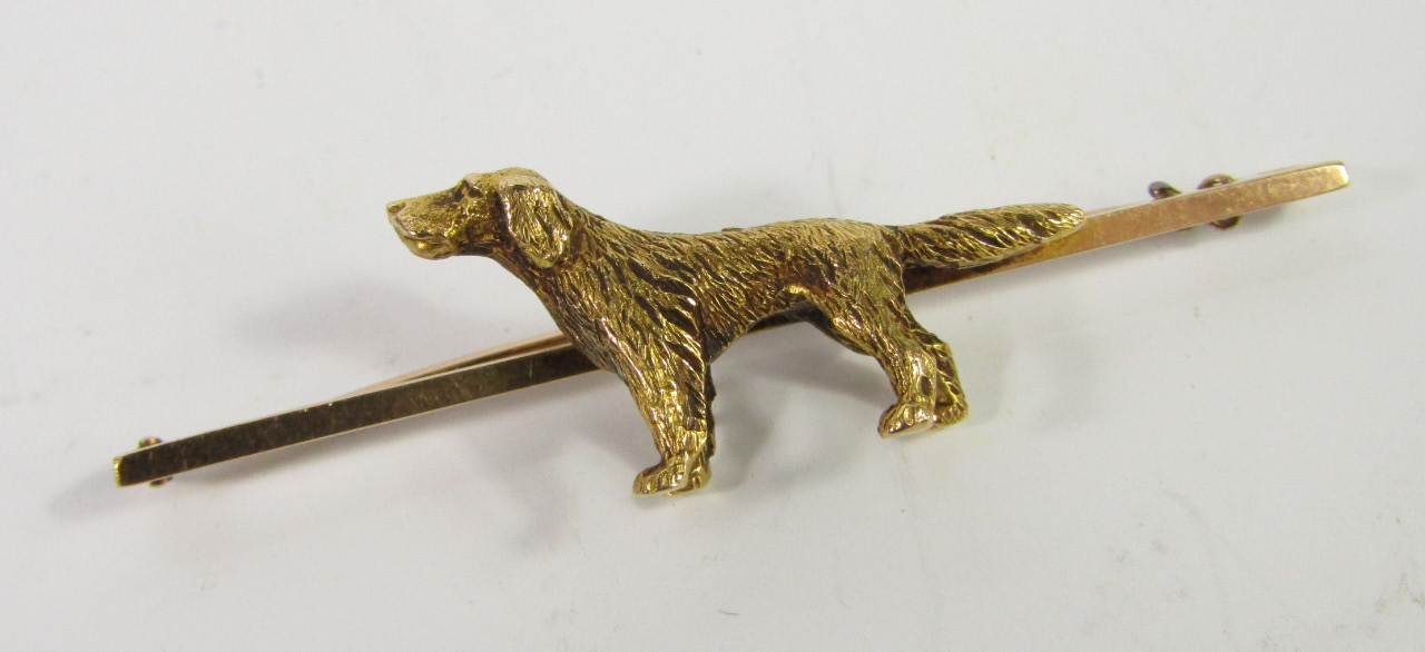 Appraisal: A bar brooch cast with a retriever yellow metal marked