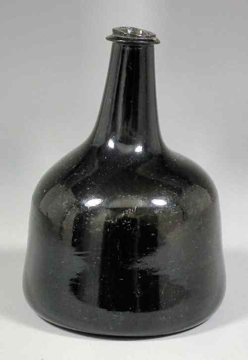 Appraisal: An early th Century English dark green glass mallet shaped