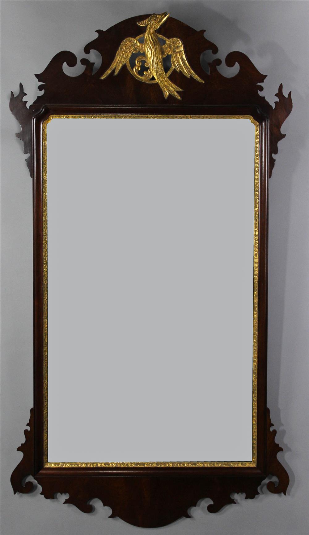 Appraisal: CHIPPENDALE STYLE CARVED AND GILDED MIRROR having a scroll cut