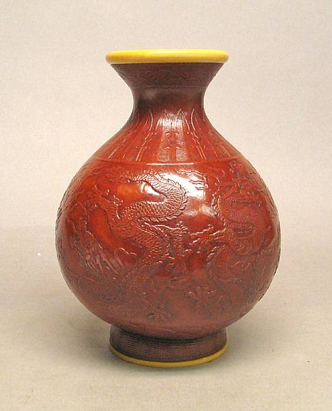 Appraisal: A molded gourd vase Its globular body molded with dragons