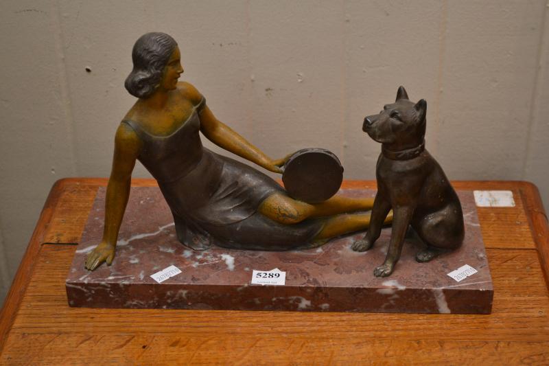 Appraisal: A BRONZE LADY AND DOG FIGURE ON MARBLE BASE A