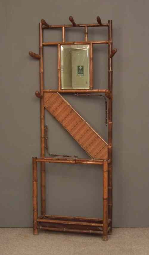 Appraisal: A late Victorian bamboo hallstand with seven hooks central bevelled