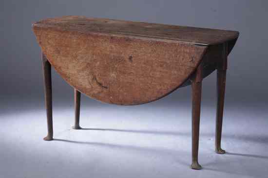 Appraisal: QUEEN ANNE OAK CIRCULAR-TOP DROP-LEAF TABLE th century ''as is''